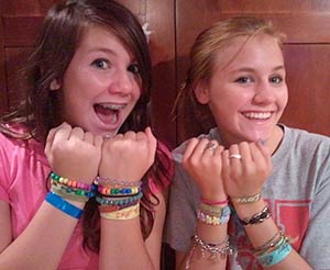 Teens model their event wristbands