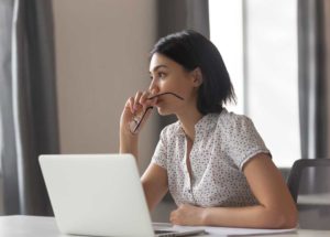 Woman evaluating business expenses